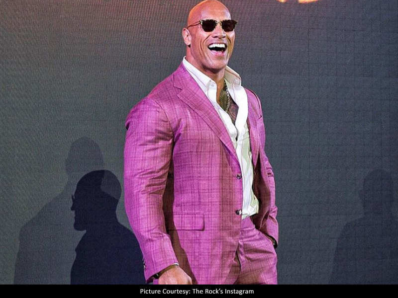 dwayne johnson pink shirt