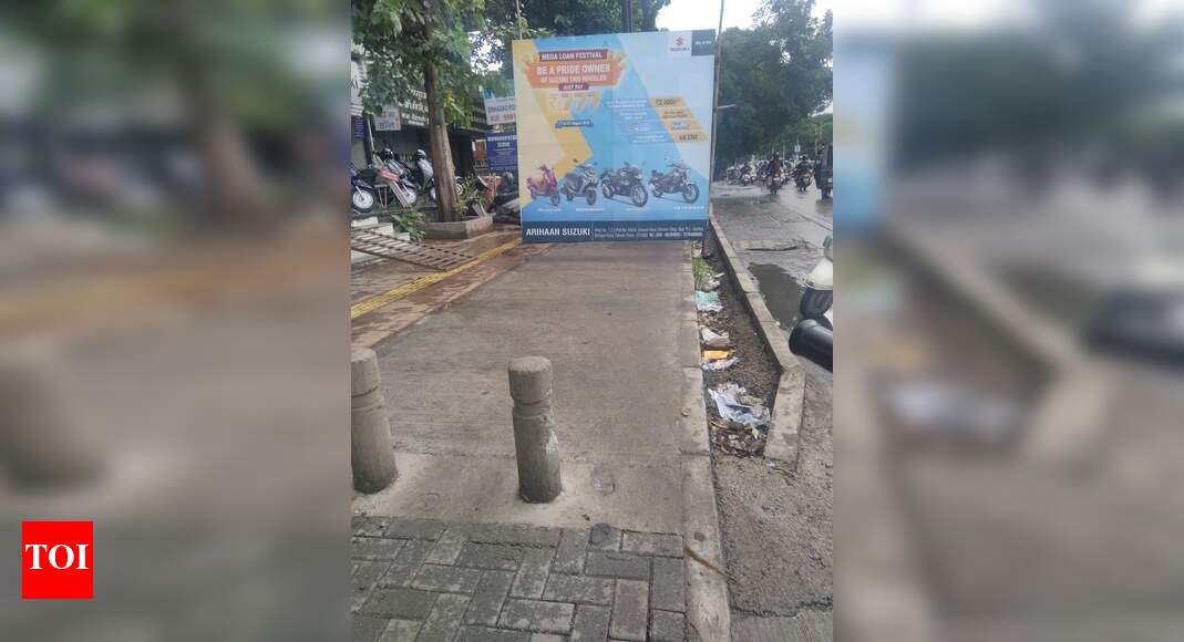 encroachment on footpath - Times of India