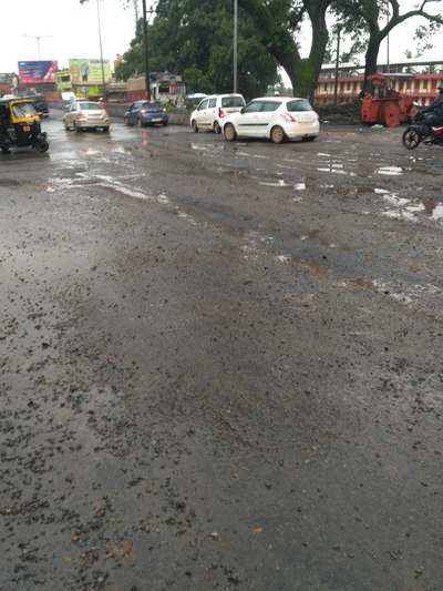 Kuloor flyover filled with water and potholes