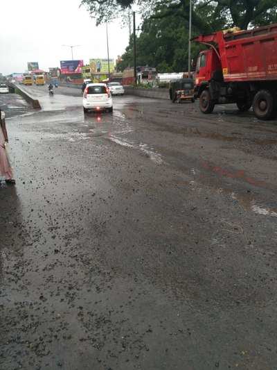 Kuloor flyover filled with water and potholes