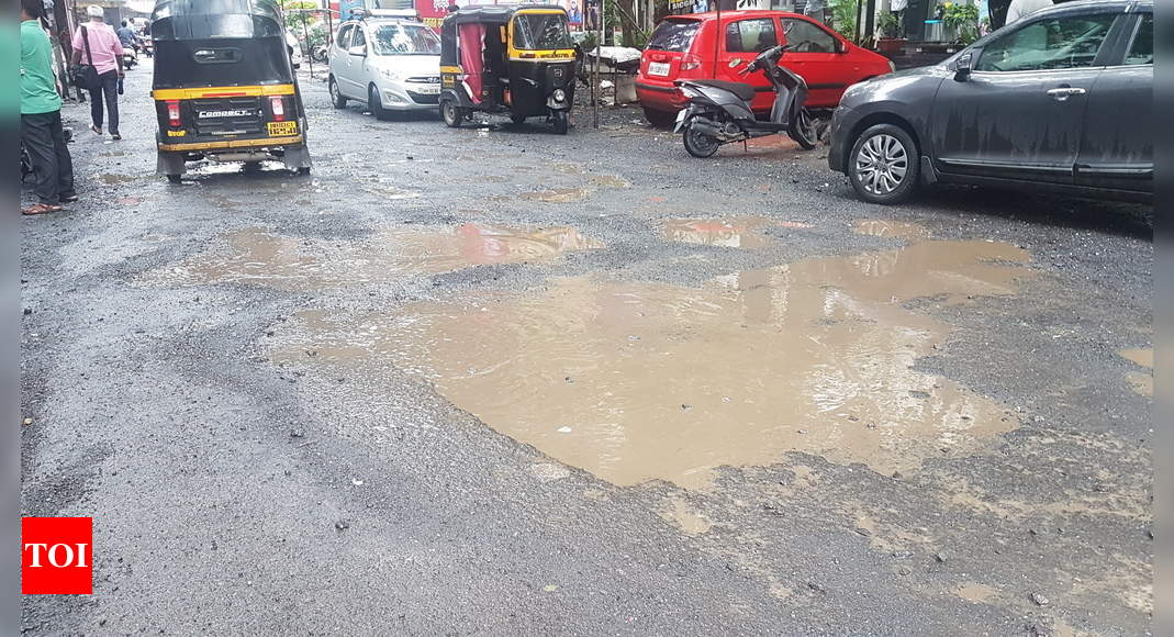 Road Ridden With Potholes Times Of India