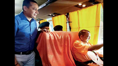 CM Yogi Adityanath, ministers skip cars, take bus to IIM-Lucknow