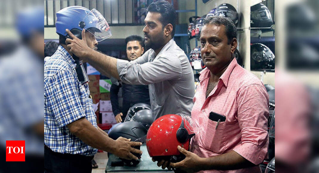 People scramble to buy new helmets Ahmedabad News Times of India
