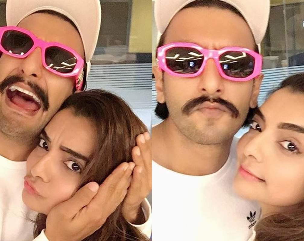 
Ranveer Singh kisses choreographer Vaibhavi Merchant as they click selfies together, his cool pink shades steal the show
