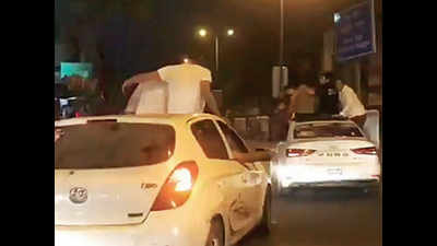 Delhi: Standing atop vehicles, youths disrupt traffic