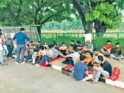 Students from Afghanistan sitting on protest outside VC office