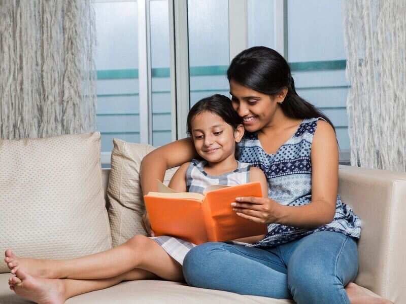 Reading to children from real books is better than reading from tablets - Times of India