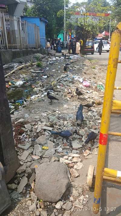 Garbage on footpath outside Dockyard Road station
