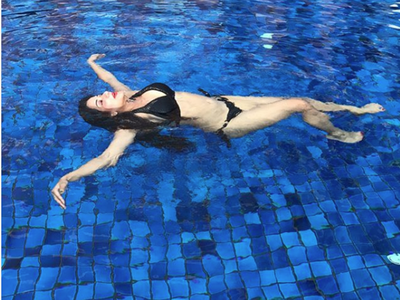 Water-baby Monalisa flaunts her envious figure in a black bikini