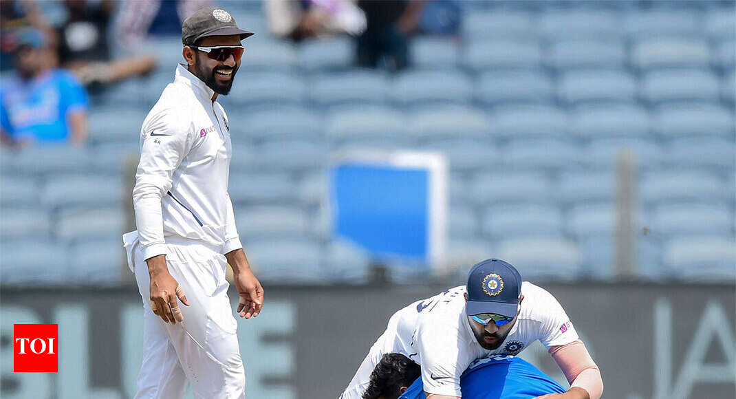Rohit falls down after fan tries to touch his feet