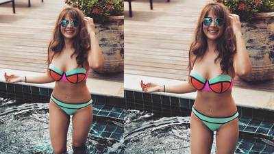 Kim Sharma's latest picture in multi coloured neon bikini is setting the internet on fire