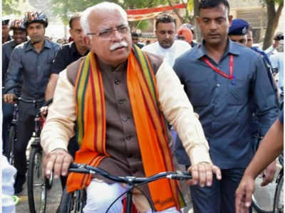 Train, e-rick and a bicycle: How Manohar Lal Khattar made it to polling booth | India News - Times of India