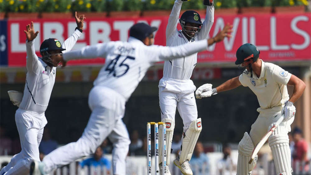 Saha, Rohit and Mayank celebrate Theunis de Bruyn wicket.