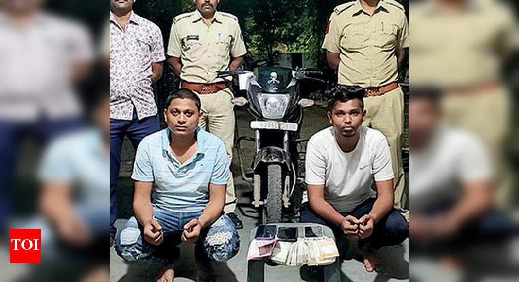 Two impersonating cops to extort money arrested | Vadodara News - Times ...
