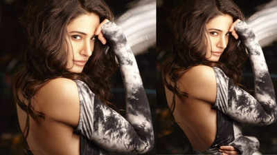 Hotness Alert! Nargis Fakhri looks drop dead gorgeous as she flaunts her well-toned body in grey and black dress
