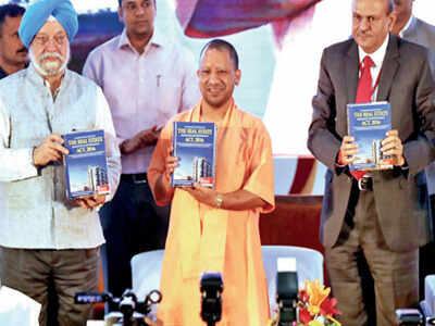 Uttar Pradesh chief minister Yogi Adityanath along with Union minister Hardeep Singh Puri (left) and UP RERA chief Rajive Kumar releasing the report on real estate on Monday