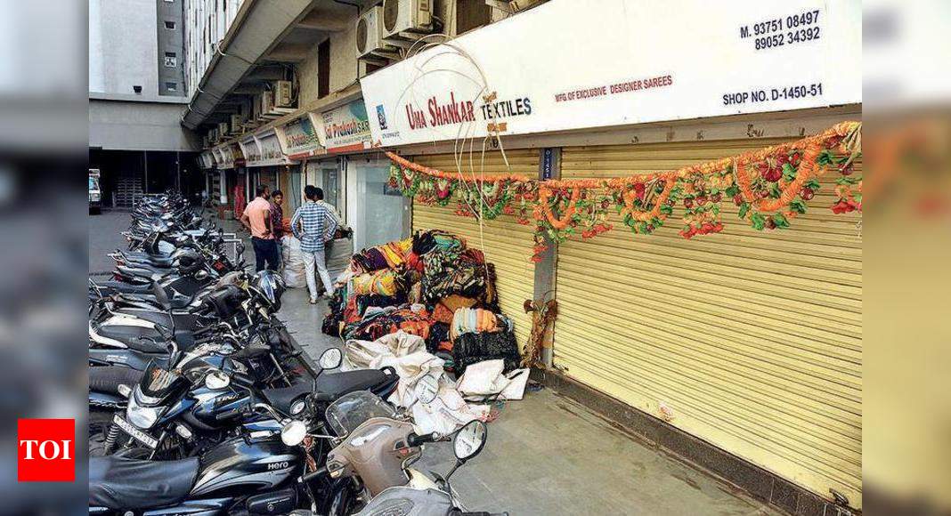 60% shops in textile markets yet to open | Surat News - Times of India