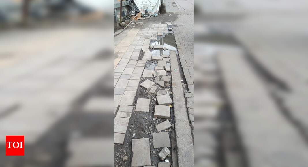 pathetic state of footpath - Times of India