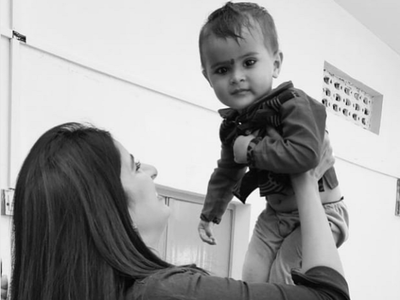 Photo: Poonam Dubey snapped playing with a baby on the sets of 'Gumraah'