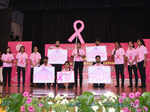 Breast cancer survivors walk the ramp at an event