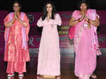 Breast cancer survivors walk the ramp at an event
