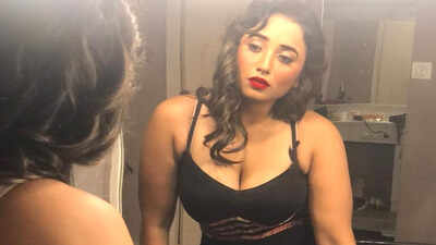 Bhojpuri actress Rani Chatterjee flaunts her red hot lipstick in this deep neck black dress!