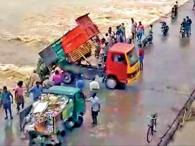 Image result for rubbish thrown into the sea by lorry"