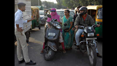 Ahmedabad: Helmet off most heads, sense prevails on some
