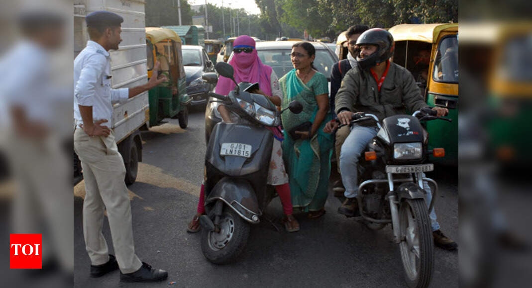 Ahmedabad Helmet off most heads, sense prevails on some Ahmedabad News Times of India