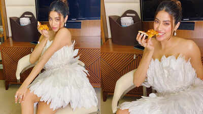Janhvi Kapoor channels frost fairy vibes as she enjoys a pizza slice in this white feathery outfit!
