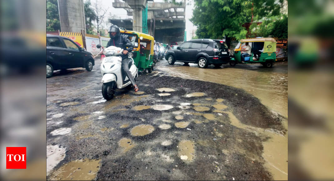 Ahmedabad: Potholes punching holes in your pockets | Ahmedabad News ...