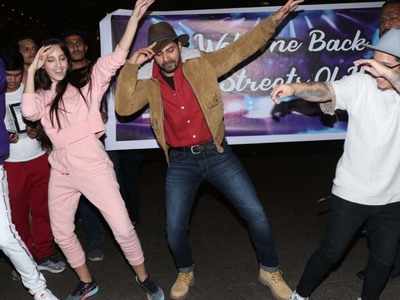 After arriving from his romantic vacay, Varun Dhawan grooves with his 'Street Dancer 3D' co-star Nora Fatehi together at the airport to promote the film
