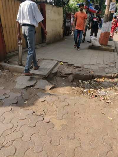 broken footpath - Times of India