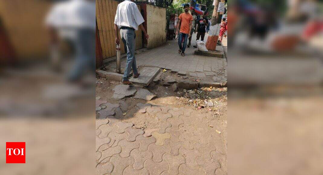 broken footpath - Times of India