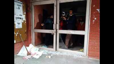 Masked goons with lathis climb over JNU hostel walls, beat up students
