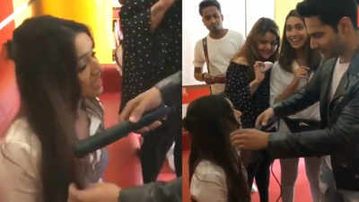 Varun Dhawan turns hairstylist for Shraddha Kapoor and her reactions are worth a watch!