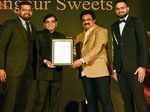 Best Mithai Shop- Raj Bansal presents the award to Karan Sharma, Keshav Sharma and Kapil Sharma of Gangaur Sweets