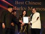 Sunita Shekhawat presents the award to Chef Raj Thappa, Chef Raju Thappa and Mukul Bhatia of Marky Momos
