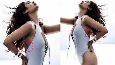 Esha Gupta teases fans with a sneak peek of her angel wings tattoo in a silver monokini