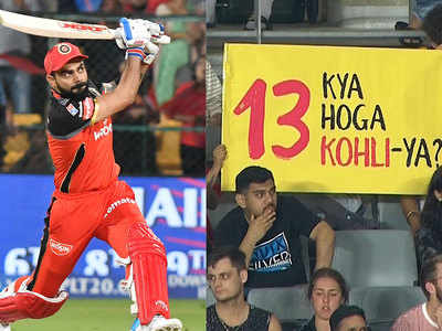 Fan holds up banner asking if season 13 of the IPL will finally see Virat Kohli break his title jinx