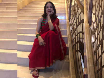 You cannot take your eyes off Neena Gupta as she poses in a ravishing red saree