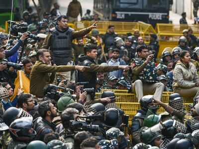 Police stop protestors to thwart their march against the amended Citizenship Act, NRC and NPR, near Jamia Nagar. (PTI Photo)