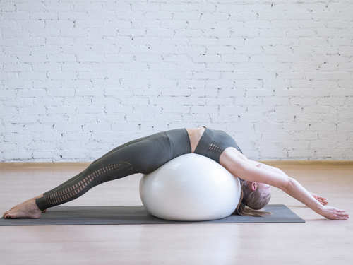 4 moves to perform with an exercise ball to get rid of nasty back pain