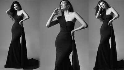 Athiya Shetty stirs up a storm on social media with her new pictures in a black shoulder banded gown