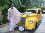 Big B cheerfully poses with his vintage car
