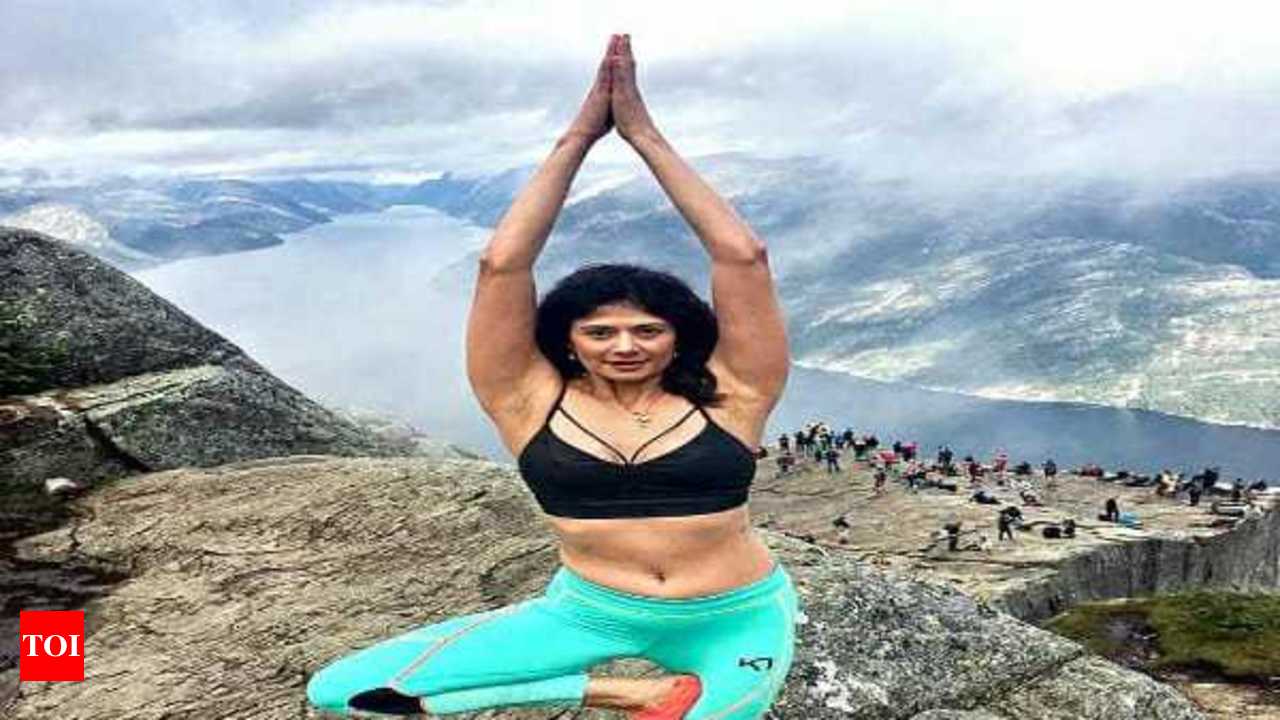 Pooja Batra in neon-green sports bra and tights does yoga. Nawab