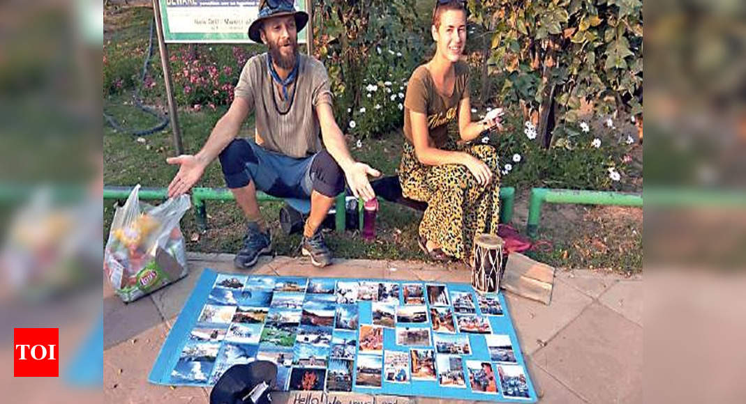 Stranded Russian Couple Sells Photos For Funds At Delhi S Lodhi Garden Delhi News Times Of India