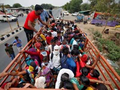 Suddenly jobless, migrant workers on long walk home