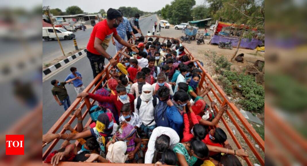 Suddenly jobless, migrant workers on long walk home | India News - The ...