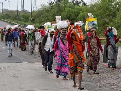 Lockdown in India: With no transport, migrants make the long march home |  India News - Times of India